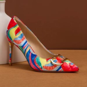 side view of colorful color blocking heels on the brown background