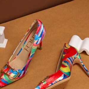 side and front view of colorful color blocking heels on the brown background