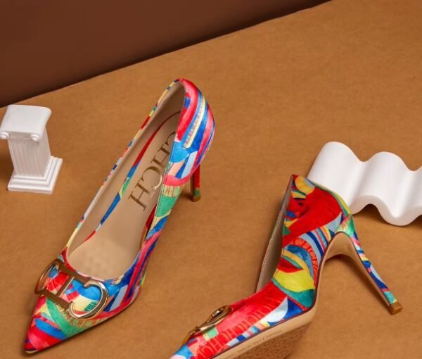 side and front view of colorful color blocking heels on the brown background