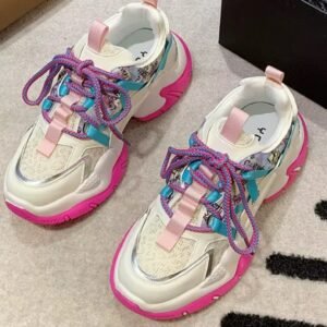 colorful color blocking sneakers lying on a white floor