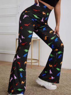 woman wearing colorful dinosaur pants and putting one foot forward