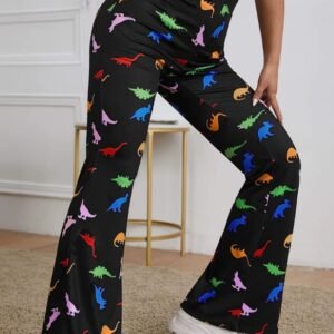 woman wearing colorful dinosaur pants and putting one foot forward