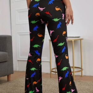 woman turned to her back wearing colorful dinosaur pants, beige room in the background