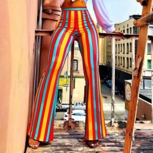 woman wearing colorful flare pants, the city in the backgorund