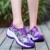 woman wearing purple colorful floral sneakers