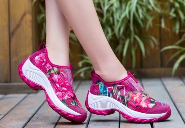 woman wearing hot pink colorful floral sneakers