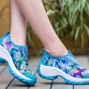 woman wearing blue colorful floral sneakers