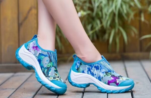 woman wearing blue colorful floral sneakers