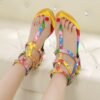 woman wearing colorful gladiator sandals