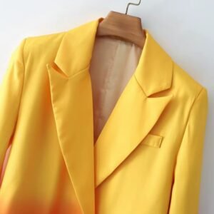 collar of colorful gradient blazer on a hanger