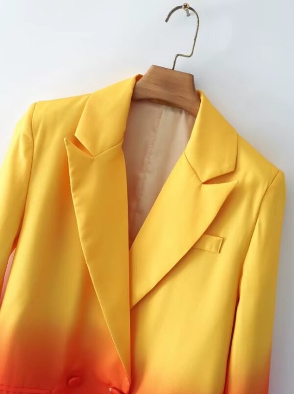 collar of colorful gradient blazer on a hanger