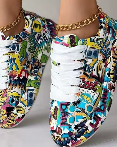 woman wearing colorful graffiti sneakers and standing on the toes