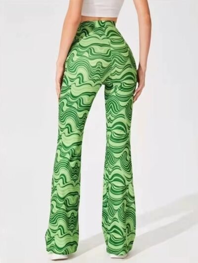 woman turned to her back wearing colorful high-waisted pants