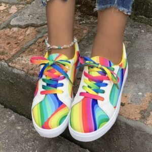 woman wearing colorful lace up sneakers on the grey stairs