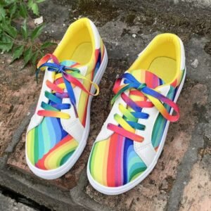 front view of colorful lace up sneakers on the brown ground