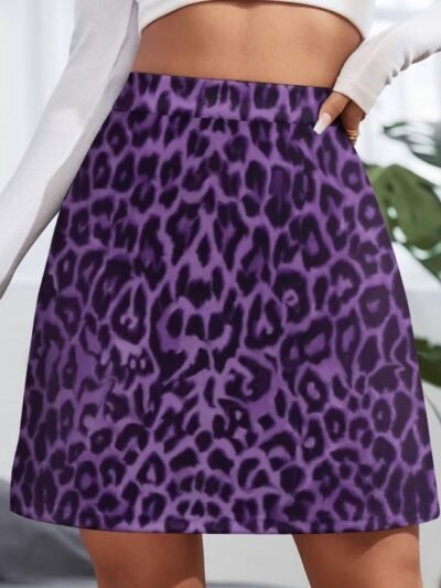woman wearing colorful leopard skirt and a white top