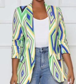 woman wearing colorful office blazer, white T-shirt and jeans, white room in the background