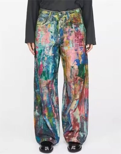 woman wearing colorful painted pants, black shoes and black blouse