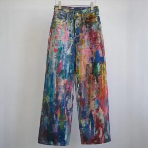 colorful painted pants hanging on the grey background