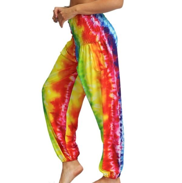 woman turned to her side wearing colorful palazzo pants