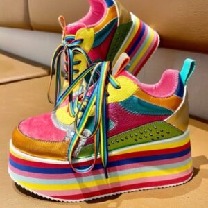 colorful platform sneakers standing on a beige ground