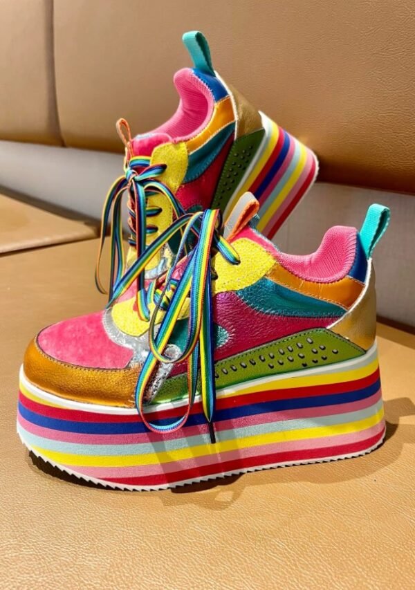 colorful platform sneakers standing on a beige ground