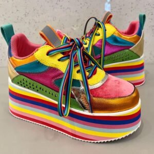 side view of colorful platform sneakers on a grey background