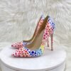 colorful polka dots heels standing on a white stool