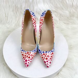 front view of colorful polka dots heels on the white stool