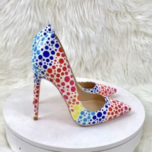 side view of colorful polka dots heels on the white stool