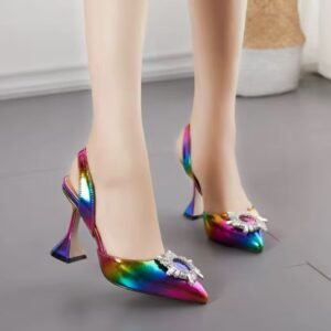 woman wearing colorful rhinestone heels on the grey floor