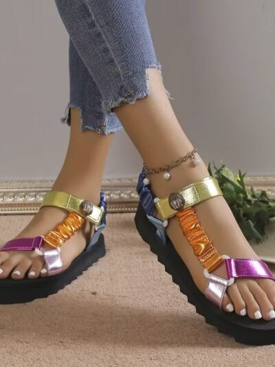 woman wearing colorful sandals for women and crossing her legs