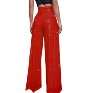 woman turned to her back wearing red colorful sequin pants, white background