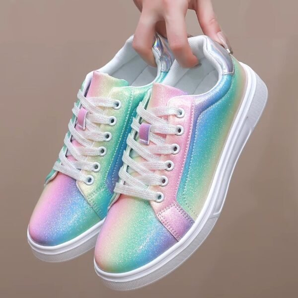 woman holding colorful skate sneakers