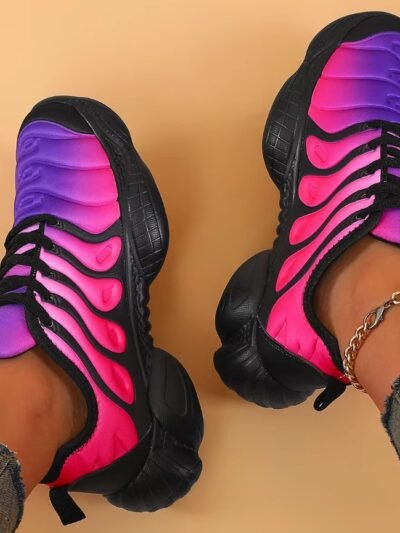 woman wearing colorful sneakers for ladies, grey jeans and golden ankle bracelet