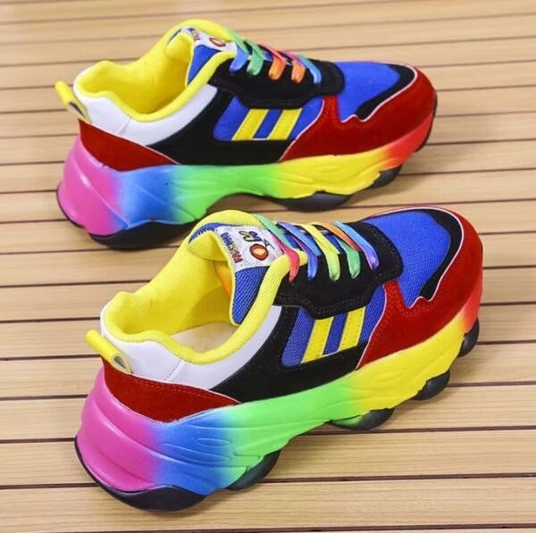 colorful sneakers for women lying on the wooden floor