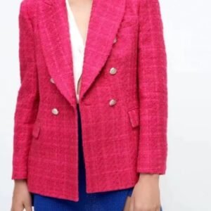 woman wearing pink colorful tweed blazer and blue shorts