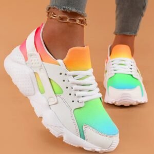 woman wearing colorful womens sneakers on the orange background