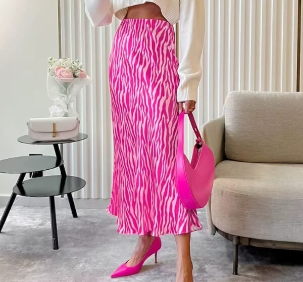 woman wearing colorful zebra skirt and pink heels, she is holding a pink purse, beige furniture in the background