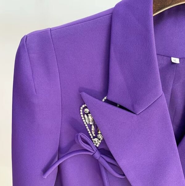 shoulder part of female purple blazer