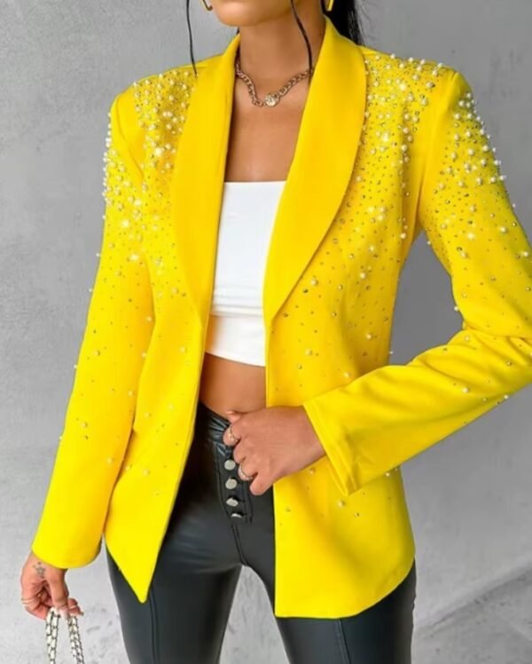 woman wearing unzipped female yellow blazer, white top and black pants