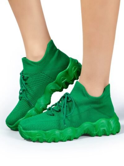 woman wearing green sneakers for women on the white background