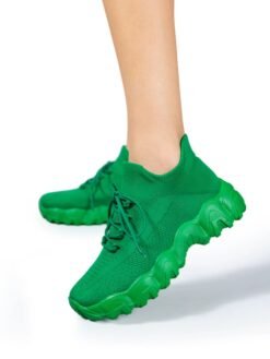 woman wearing green sneakers for women and exposing their side view