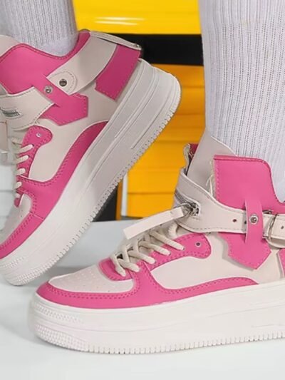 woman wearing high colorful sneakers with white socks, yellow seats in the background