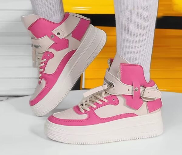 woman wearing high colorful sneakers with white socks, yellow seats in the background