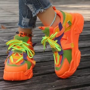 woman wearing neon colorful sneakers exposing their side and front view, brown wood under them