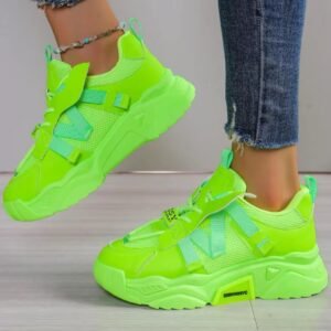 woman wearing neon green sneakers and lifting one foot