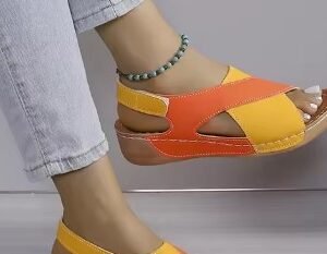 woman wearing open toe colorful sandals and bright jeans