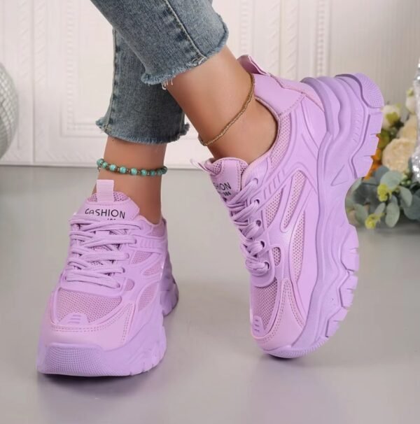 woman wearing lavender pastel sneakers exposing their side view