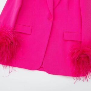 bottom part of pink blazer with feathers